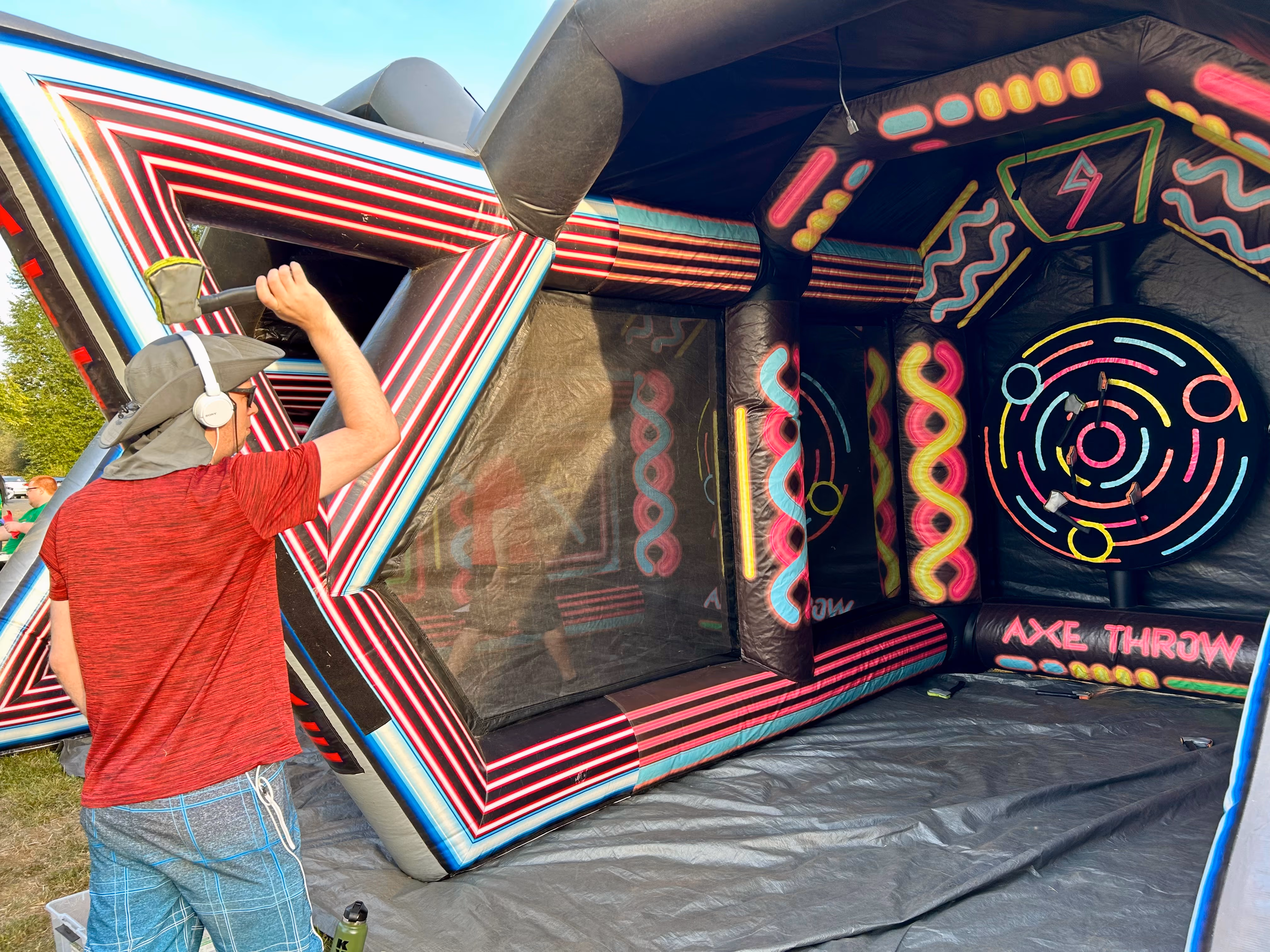 a camper doing inflatable axe throwing